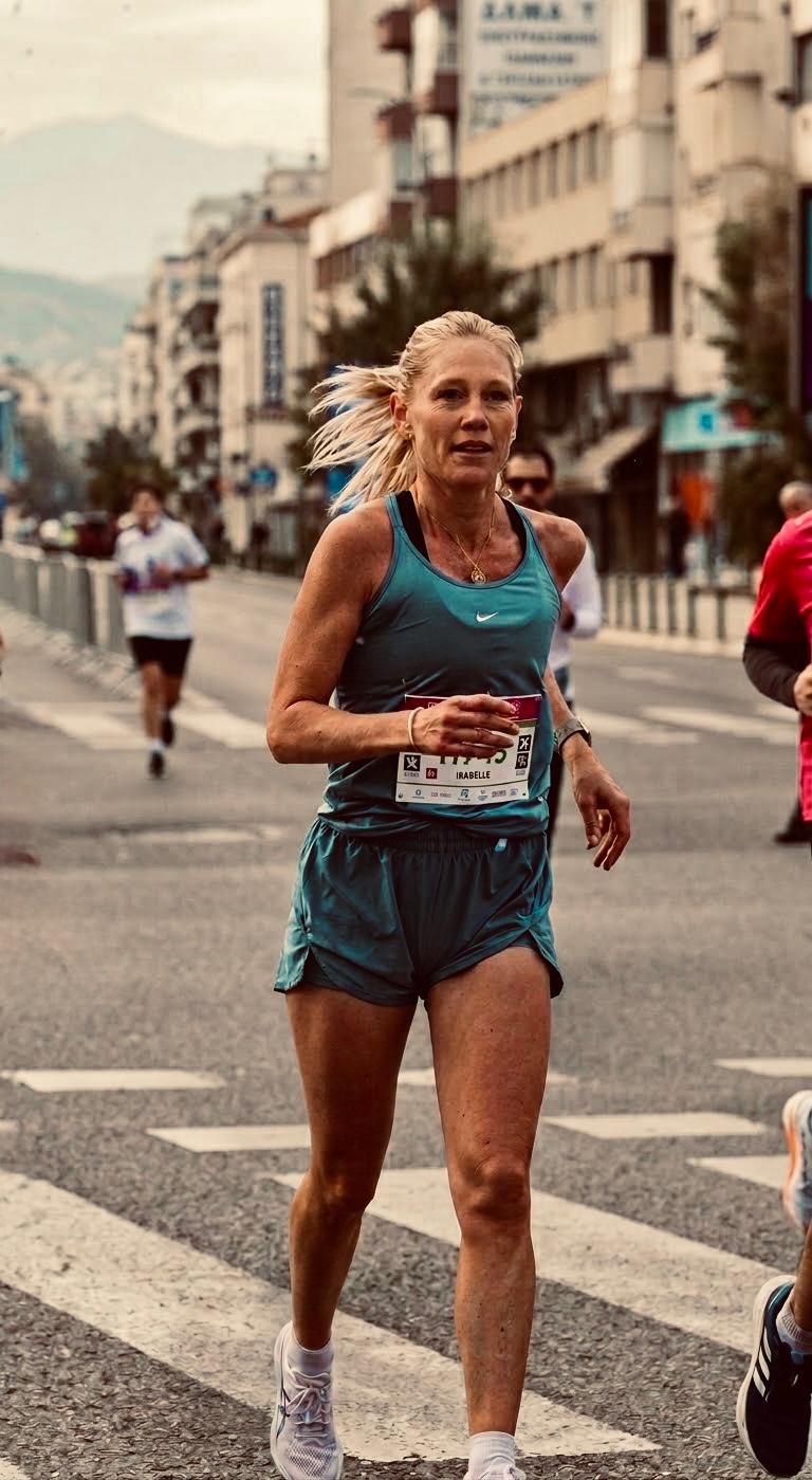 Marathon runner in warm city light